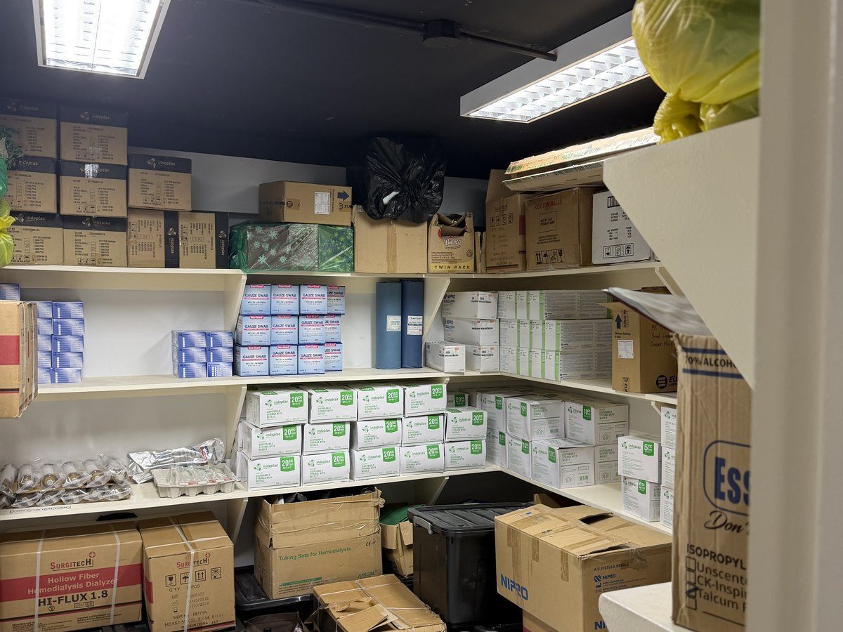 The stock room: shelves of boxed consumables.